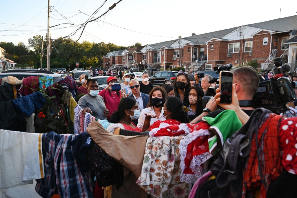 Gov. Kathy Hochul speaks with Kissena Park, Queens residents while touring flood damaged homes from Hurricane Ida,