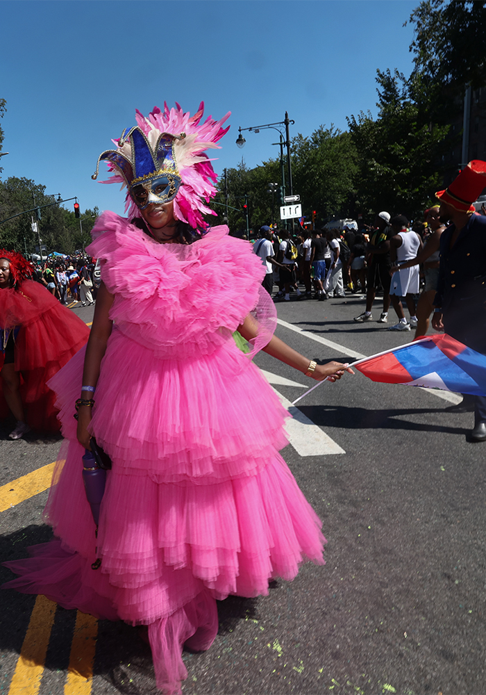 Masqueraders in beautiful costumes walk on Eastern Parkway during the West Indian Day Parade in Brooklyn, N.Y., Sept. 7, 2026. Photo by Bill Farrington for The Haitian Times.