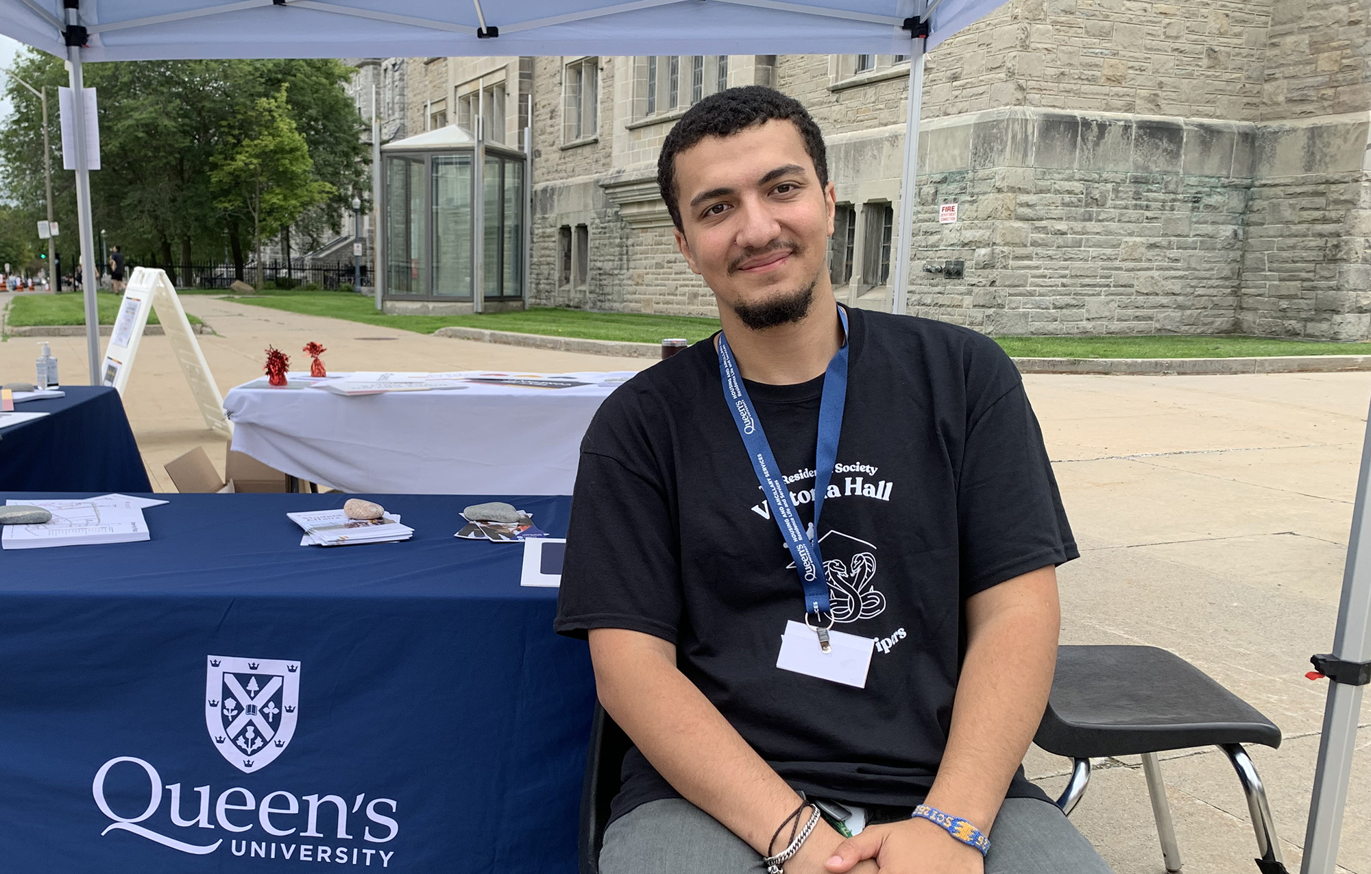 man sits at university campus