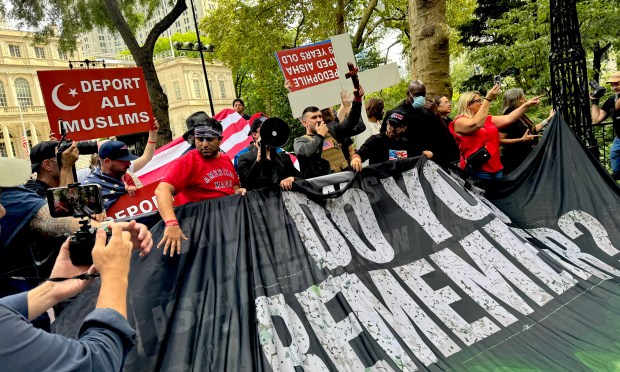 A crowd gathers in City Hall Park in Lower Manhattan on Sept. 11, 2026, as Jake Lang shouts anti-Muslim sentiments. (Rebecca White / New York Daily News)
