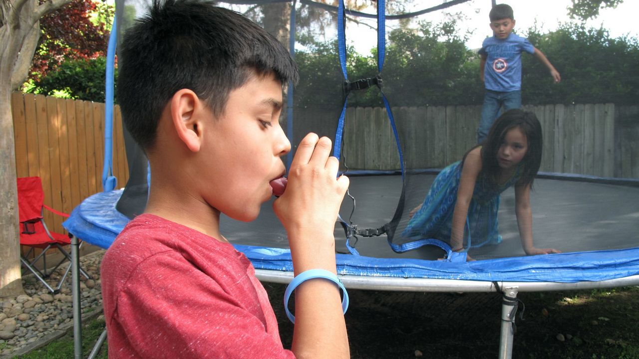 Kid with asthma inhaler