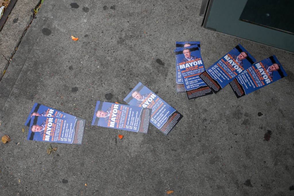 Andrew Cuomo mayoral campaign flyers were scattered at an East Harlem bus stop,