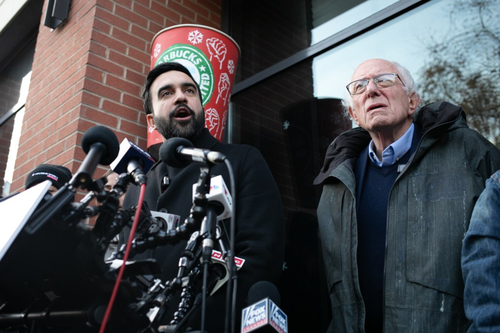 Mayor-elect Zohran Mamdani speaks alongside Sen. Bernie Sanders (I-VT) at a Starbucks worker picket line in Brooklyn,