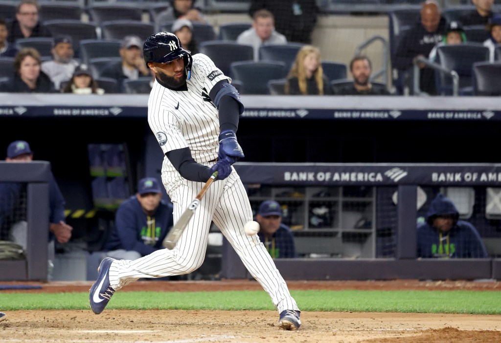 New York Yankees third baseman Amed Rosario bats against the Tampa Bay Rays at Yankee Stadium.