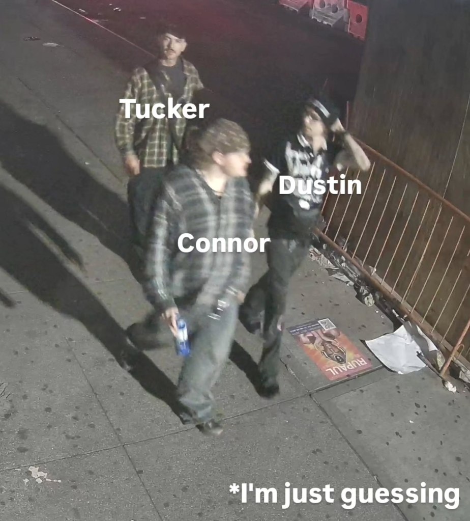Three vandals walking down the street.