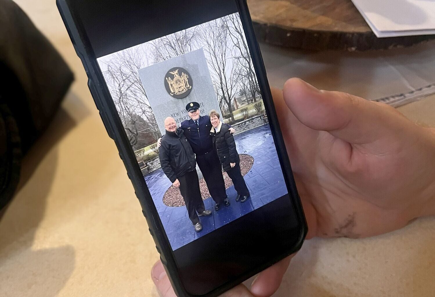 Kellan Livsey with his grandparents on the day he graduated from the Training Academy in Albany. He worked as a corrections officer for seven years before resigning this spring. Photo: Emily Russell