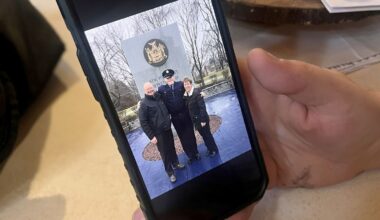 Kellan Livsey with his grandparents on the day he graduated from the Training Academy in Albany. He worked as a corrections officer for seven years before resigning this spring. Photo: Emily Russell