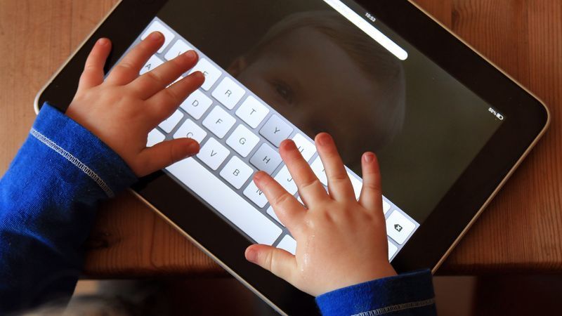 GLASTONBURY, UNITED KINGDOM - NOVEMBER 25:  In this photo illustration 13-month old Zac Cardy uses a iPad at his home on November 25, 2011 in Glastonbury, United Kingdom. Tablet computers have become the most wanted Christmas present for children between the ages of 6-11 years. Many parents are having to share their tablet computers with their children as software companies release hundredes of educational and fun applications each month.   (Photo by Matt Cardy/Getty Images)