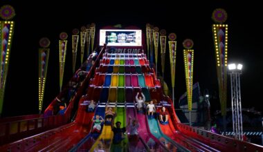Fairgoers go down the slide at the New York State Fairgrounds.