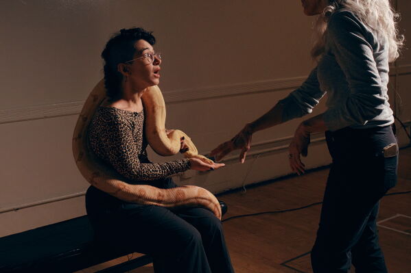 Animal talent expert Nancy Novograd, right, interacts with performance artist Zoe Ziegfeld, who plays the part of a snake charmer, during auditions to select a snake for a part in an adaptation of Mozart’s “Così fan tutte," at the Metropolitan Opera in New York, Friday, Aug. 28, 2026. (AP Photo/Andres Kudacki)