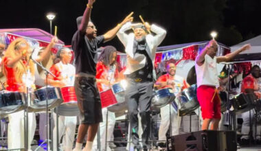 Pan Evolution Steel Orchestra on stage with arranger André White (center) and artists “Full Blown” for New York Panorama 2026