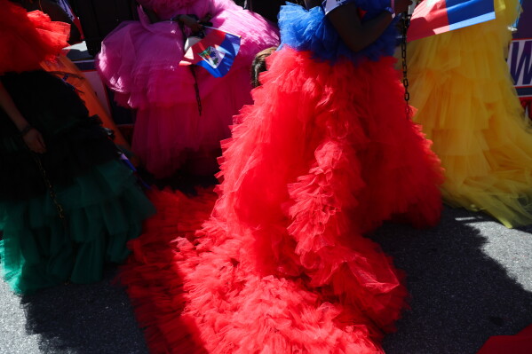 Members of the Haitian group Lamar wait for the start of the West Indian Day Parade on Monday, Sept. 7, 2026, in the Brooklyn borough of New York. (AP Photo/Heather Khalifa)
