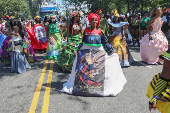 Members of the Lespri Ayiti Haitian carnival band participate in the West Indian Day Parade on Monday, Sept. 7, 2026, in the Brooklyn borough of New York. (AP Photo/Heather Khalifa)