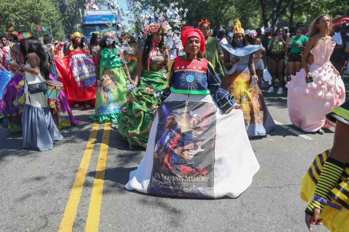 Members of the Lespri Ayiti Haitian carnival band participate in the West Indian Day Parade on Monday, Sept. 7, 2026, in the Brooklyn borough of New York. (AP Photo/Heather Khalifa)