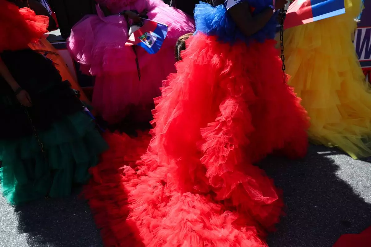 Members of the Haitian group Lamar wait for the start of the West Indian Day Parade on Monday, Sept. 7, 2026, in the Brooklyn borough of New York. (AP Photo/Heather Khalifa)