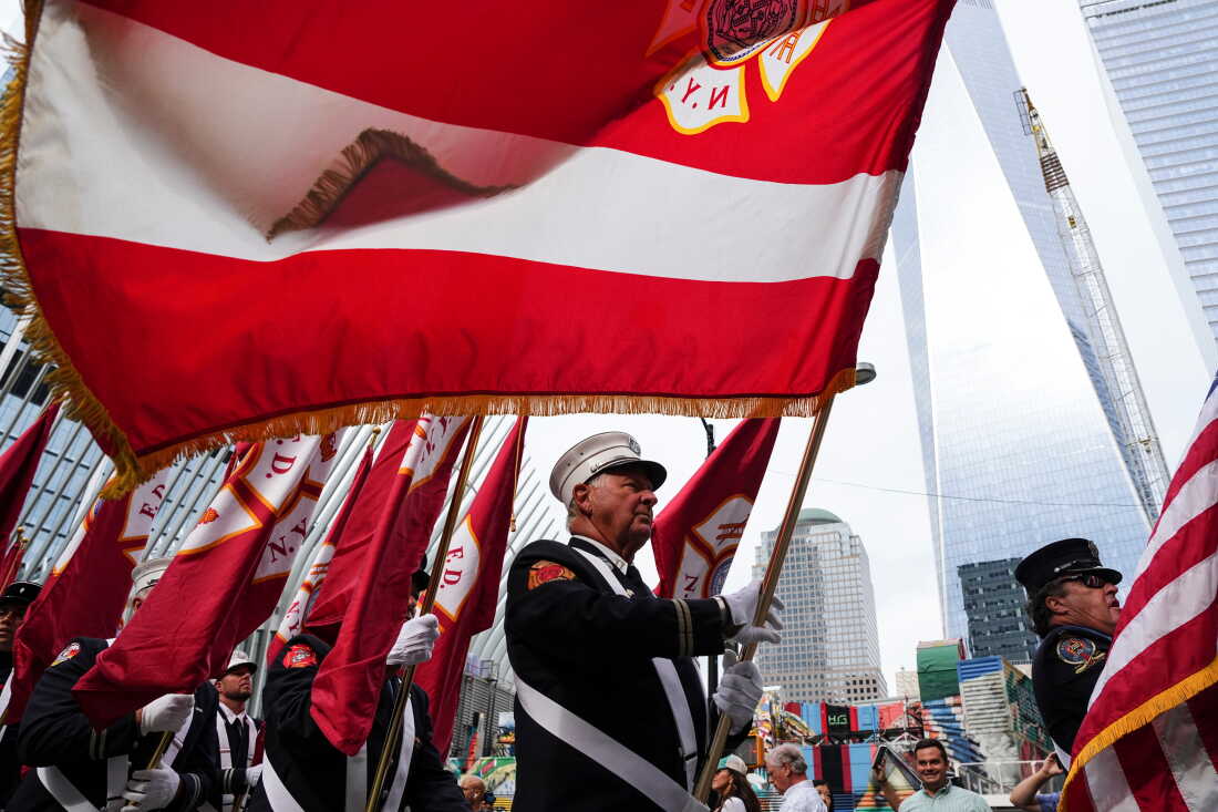 New York City firefighters carry flags as they march near the memorial on the 25th anniversary of the September 11, 2001 terrorist attacks on Sept. 11, 2026.