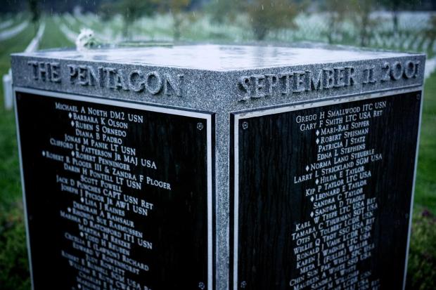 The Pentagon Group Burial Marker stands among headstones at Arlington National Cemetery shortly after sunrise, Friday, Sept. 11, 2026, in Arlington, Va. (AP Photo/Julia Demaree Nikhinson)