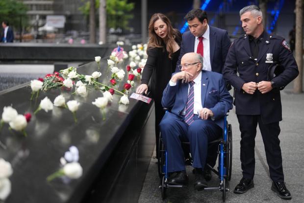 Former New York mayor Rudy Giuliani observes the memorial on the 25th anniversary of the September 11, 2001, terrorist attacks, Friday, Sept. 11, 2026, in New York. (AP Photo/Adam Gray, Pool)