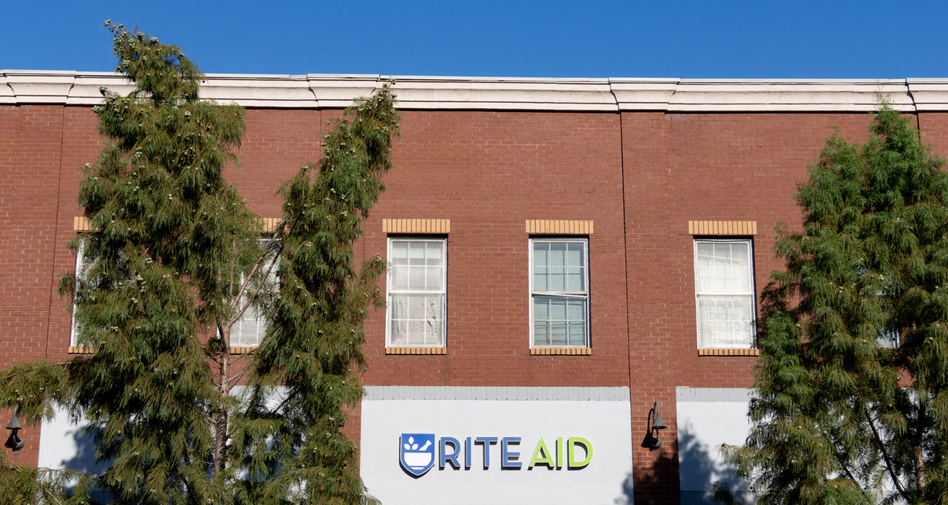 low scale brick building with rite aid sign