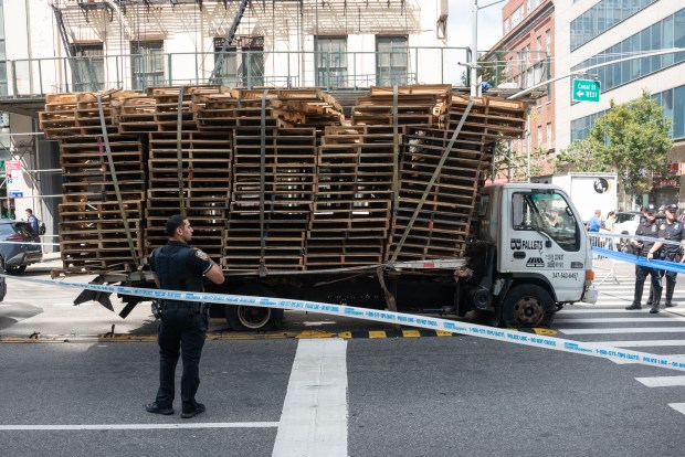 Police investigate after multiple pedestrians were struck by a truck on Canal St. and the Bowery in Manhattan on Thursday. 
