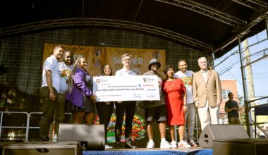 Gotham Health Regional Medical Director Dr. Jeremy O’Connor and Regional Administrator Cari Harewood receive a $4.8 million capital funding check from Council Member Kevin C. Riley to support improvements at Gotham Health, Gun Hill.