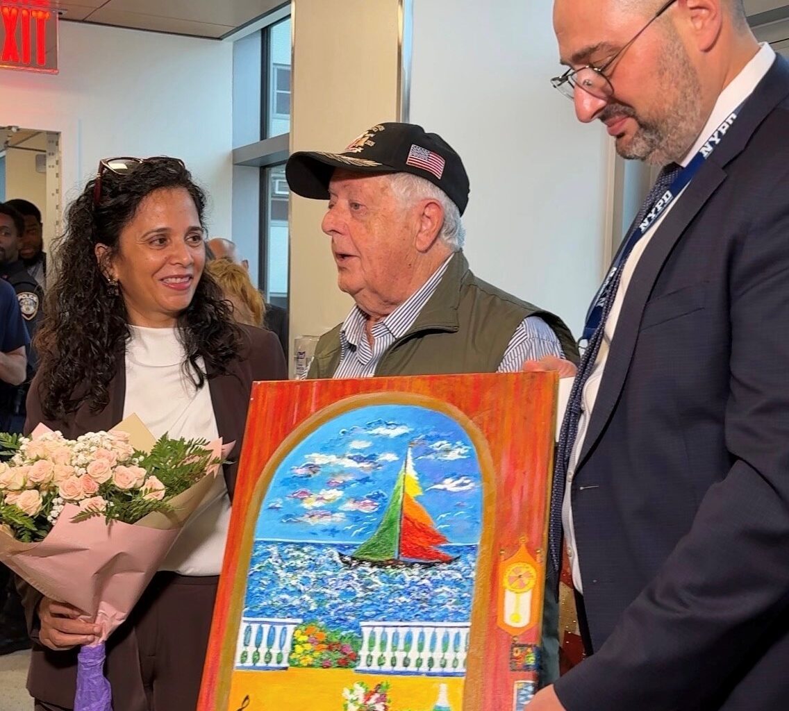 Manjinder Kaur, CEO of South Brooklyn Health is presented with a gift from Alex Zhorov, Chairman and President of Be Proud Inc. of Brooklyn, a painting by artist Roman Khrapunskiy honoring the hospitals doctors and staff.