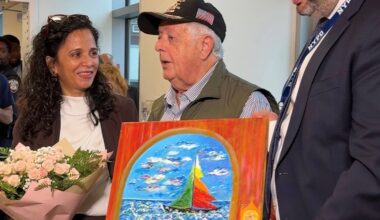 Manjinder Kaur, CEO of South Brooklyn Health is presented with a gift from Alex Zhorov, Chairman and President of Be Proud Inc. of Brooklyn, a painting by artist Roman Khrapunskiy honoring the hospitals doctors and staff.