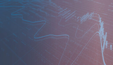 decorative photo of line and bar chart over data