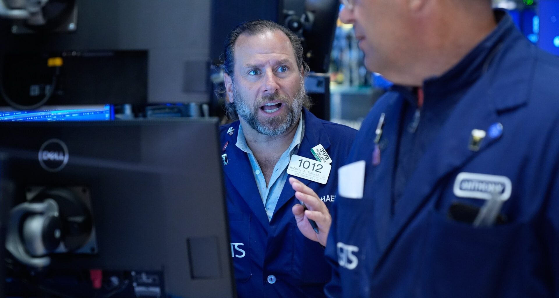 Wall Street holds near record as Brent oil falls below $100 per barrel