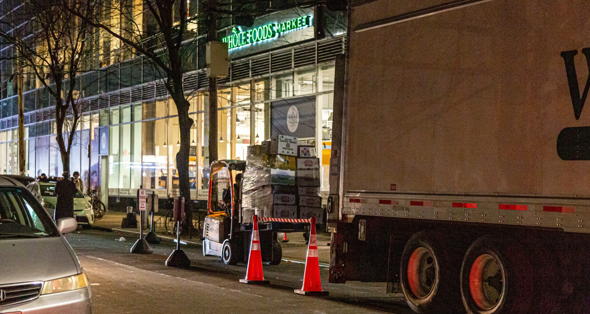 An image of businesses making deliveries overnight during off-peak hours.