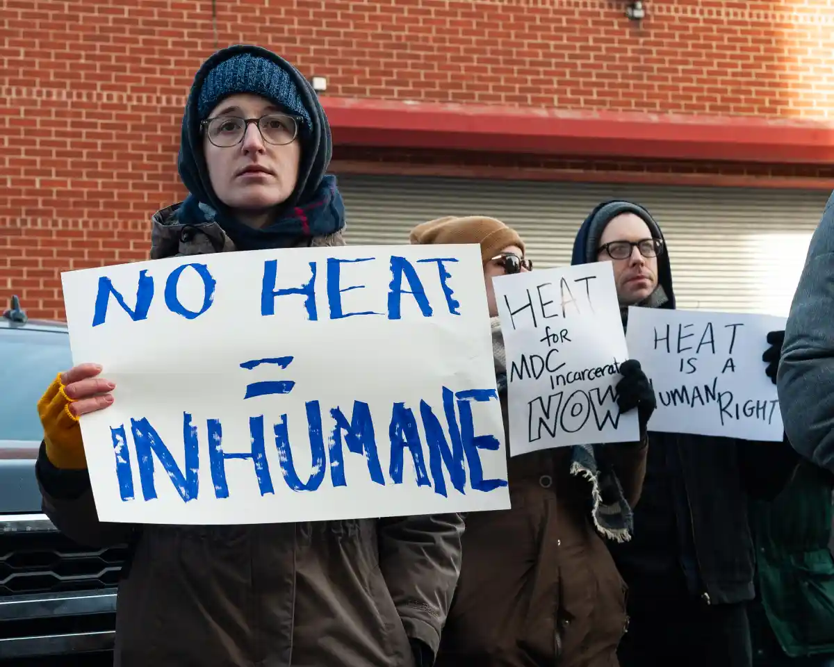 people holding signs