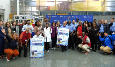Hospital representatives from various departments at NYC Health + Hospitals/Queens gather for a group photo alongside external partners at the Emergency Preparedness Expo. This collaborative effort highlights the commitment of multiple organizations to enhance community resilience and preparedness through education and resource sharing.
