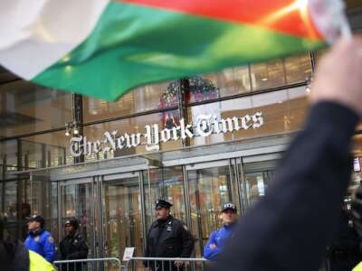 Pro-Palestine activists march in front of the New York Times headquarters as they participate in a Global Strike for Gaza on December 18, 2023 in New York City, New York.