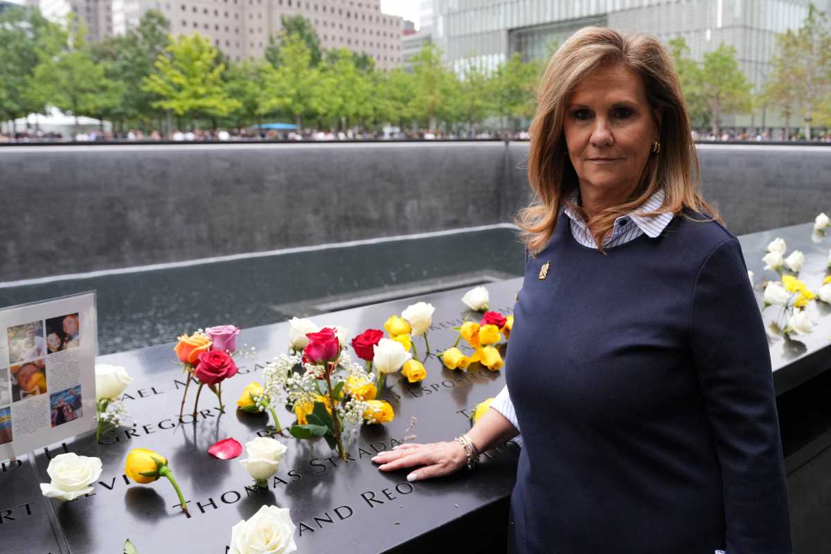 Terry Strada, National chair of the group 9/11 Families United, poses near  the memorial on the 25th anniversary of the September 11, 2001 attacks, Friday, Sept. 11, 2026, in New York.     