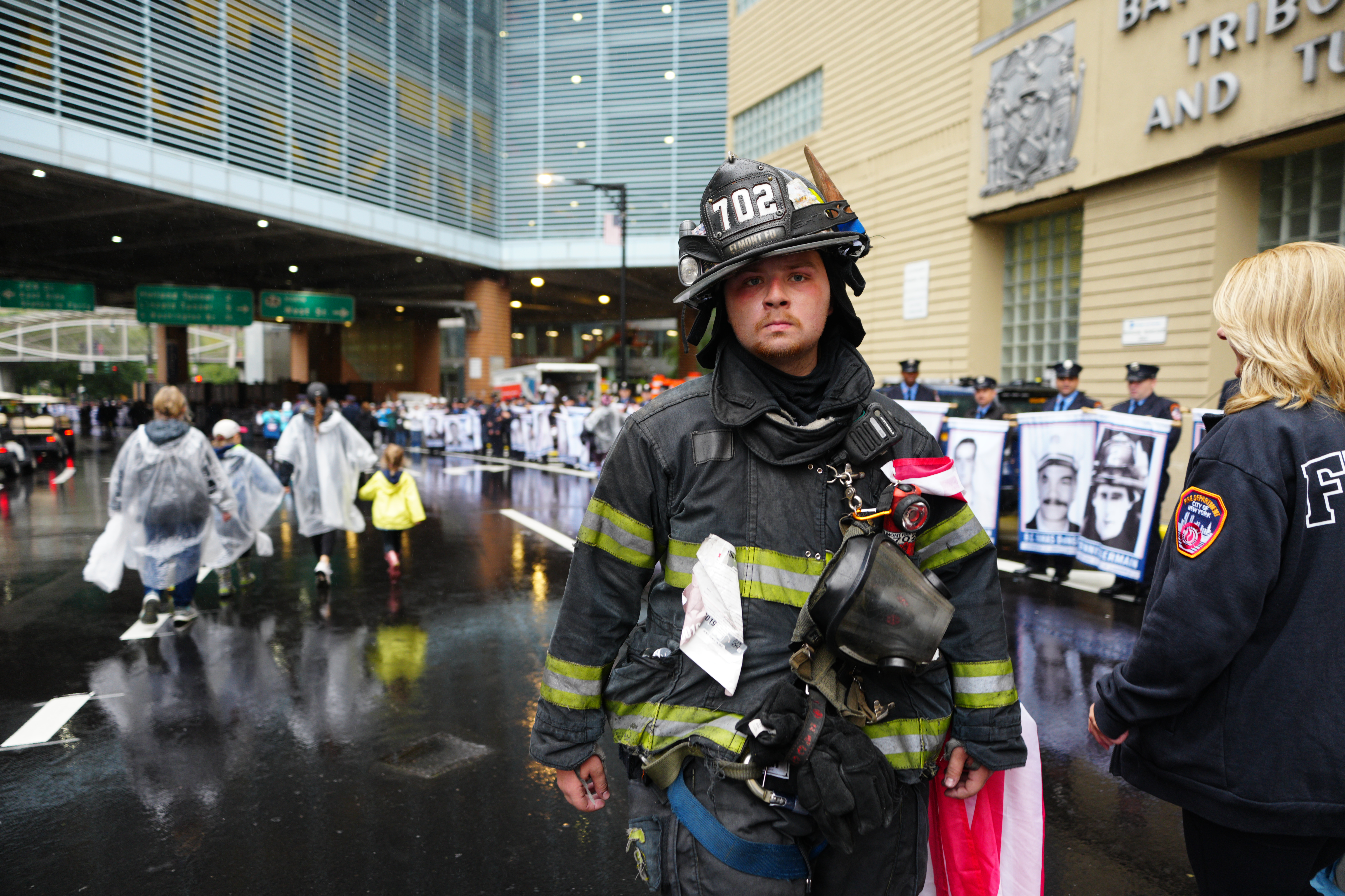 A firefighter in full gear and helmet during the 25th annual Tunnel to Towers NYC 5K Run & Walk.