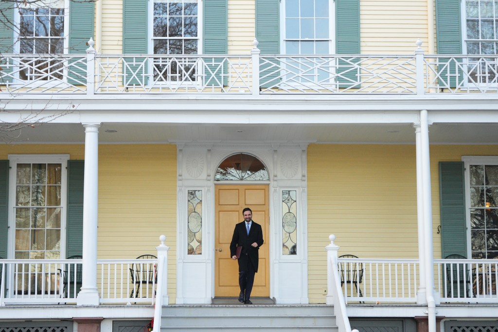 New York City Mayor Zohran Mamdani walking on the steps of Gracie Mansion.