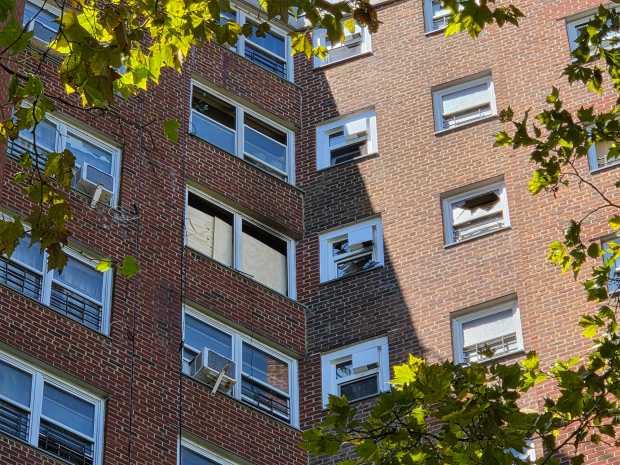 Broken windows are seen in a building in NYCHA's Albany Houses on Troy Ave. near Bergen St. in Crown Heights on Saturday, Aug. 29, 2026 after a fatal lithium-ion battery fire.