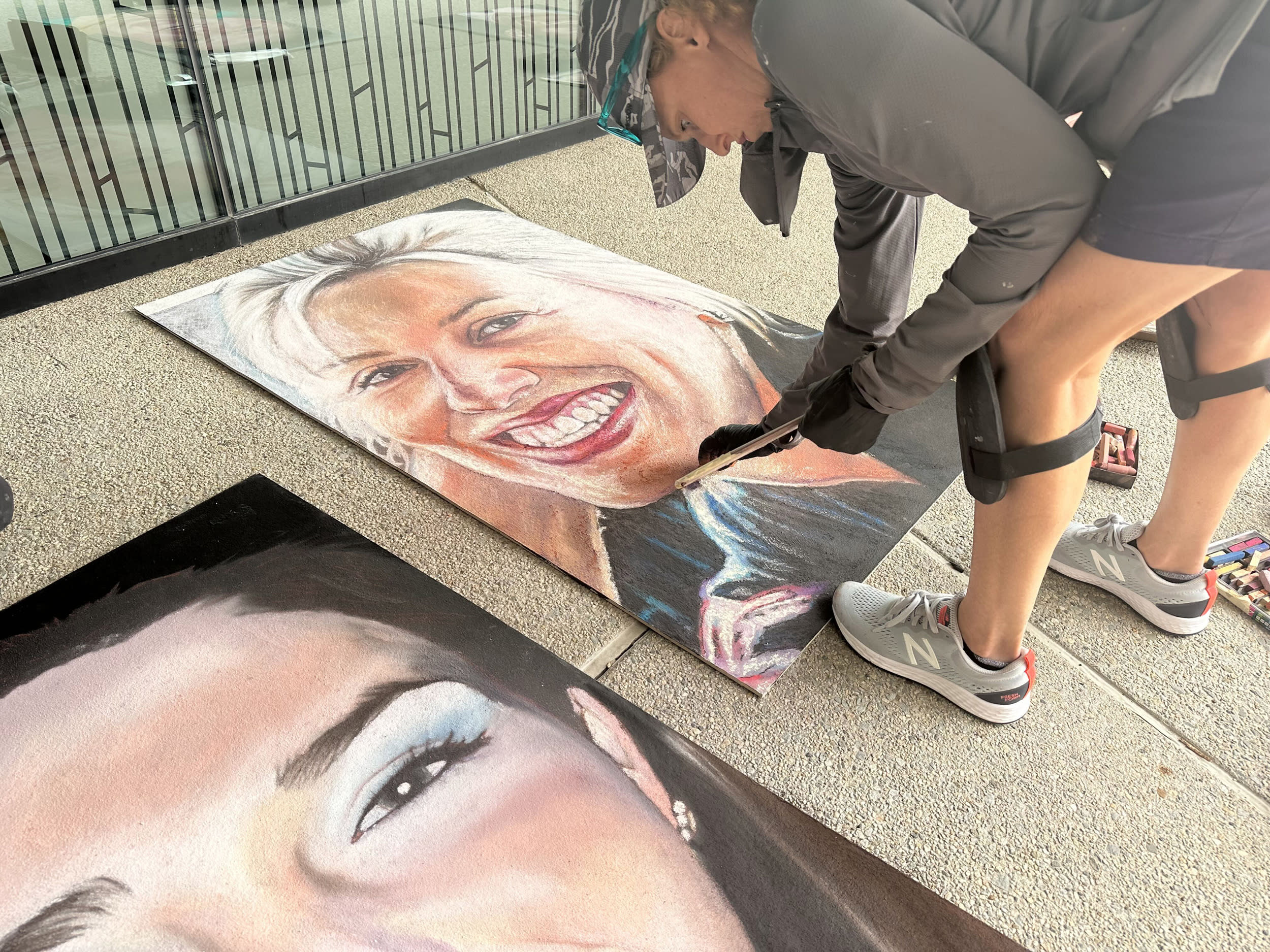 20 artists battled light rain and breezy conditions to put the final touches on chalk portraits of the 40 heroes aboard Flight 93.