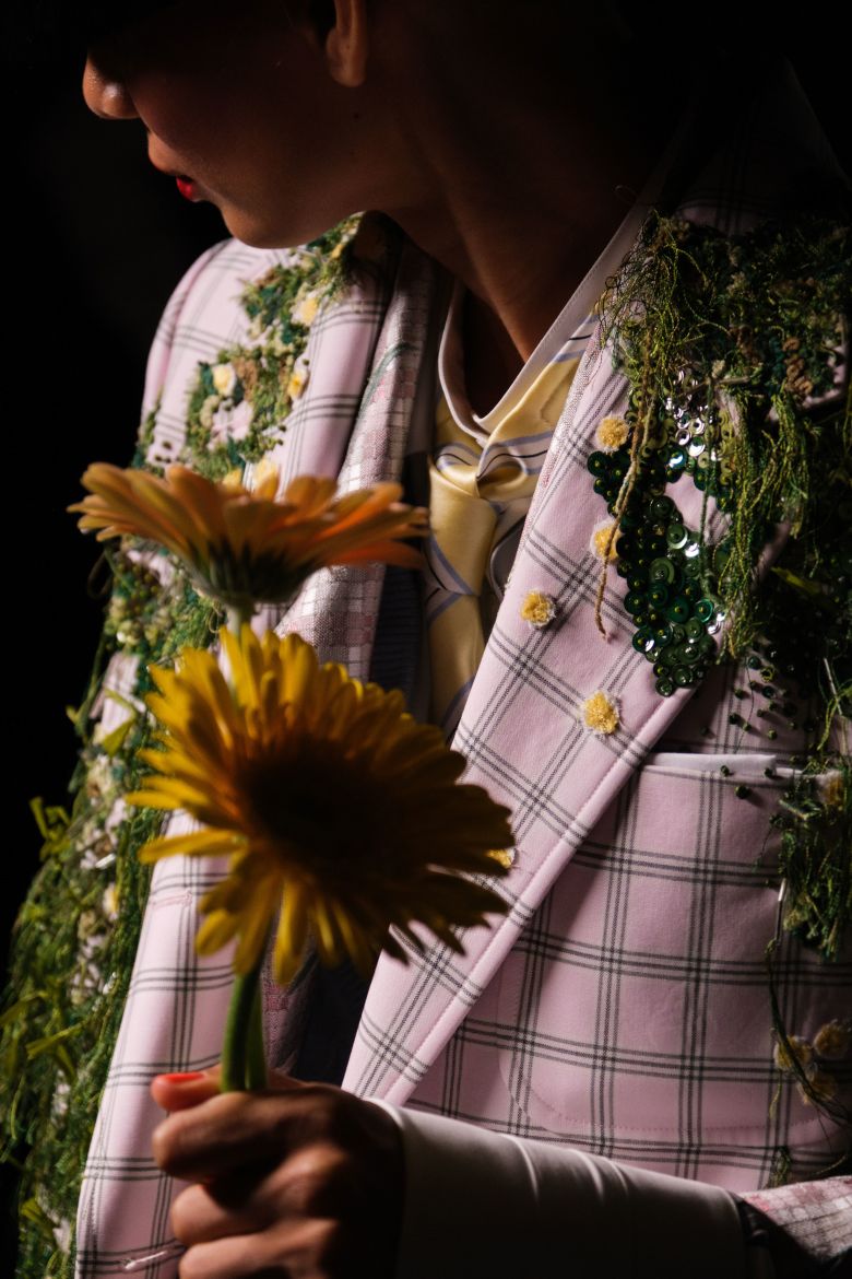 Mossy detailing adorns plaid Thom Browne blazers.
