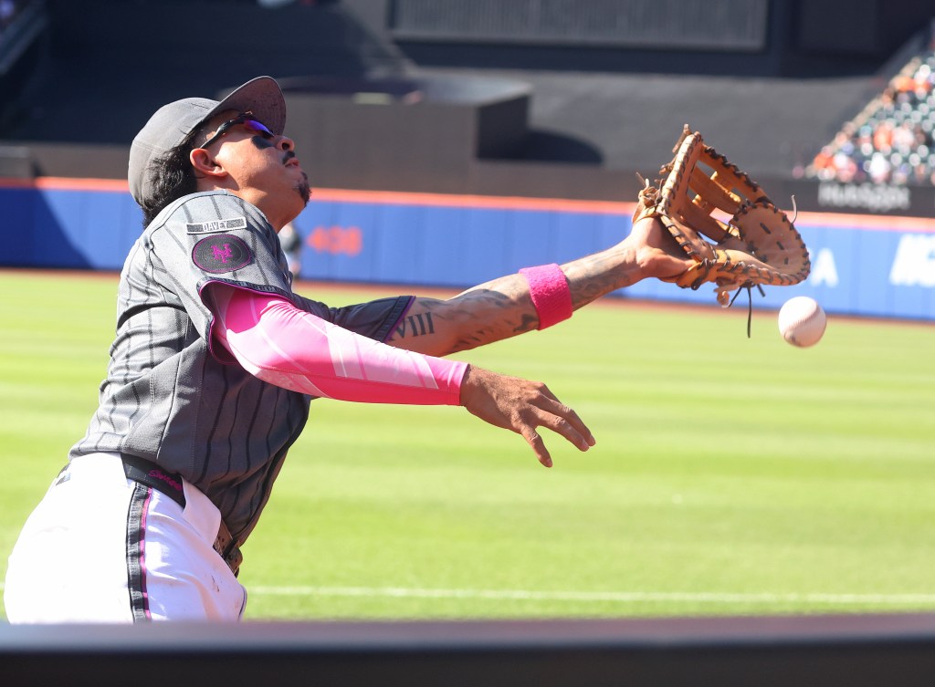 New York Mets first baseman Mark Vientos misses a foul ball.