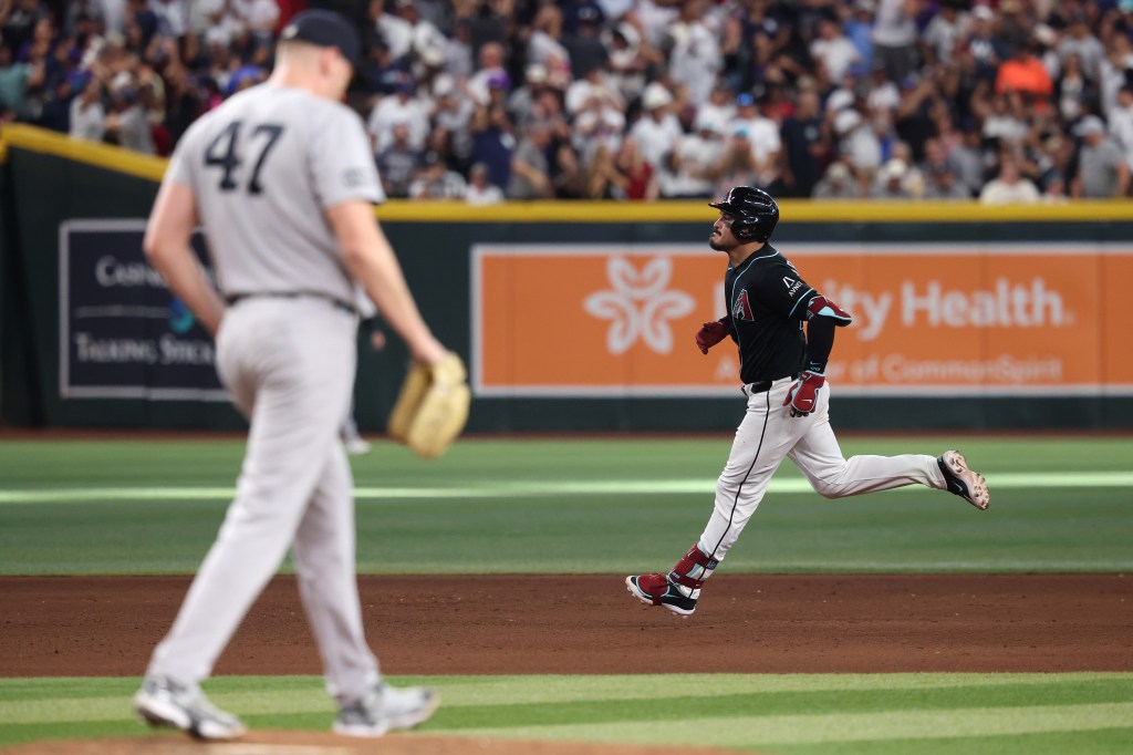 Nolan Arenado of the Arizona Diamondbacks runs the bases after hitting a grand slam.