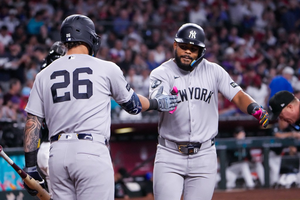 New York Yankees Heliot Ramos (34) celebrates his home run with Luis Garcia Jr. (26).