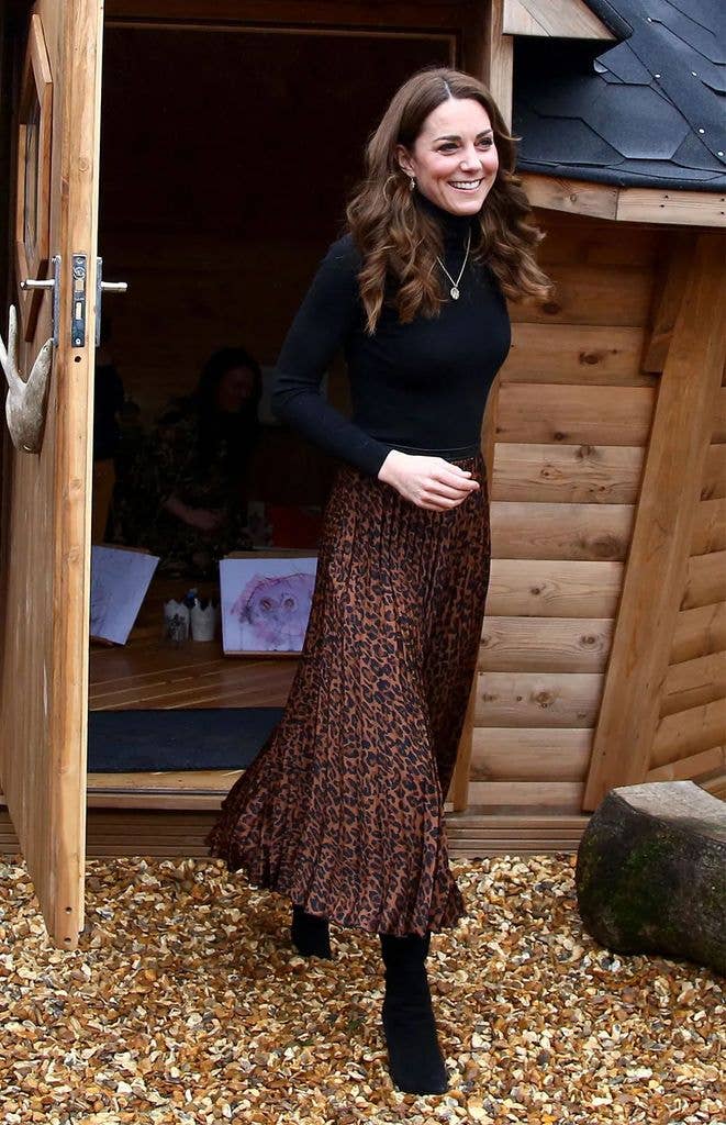 Kate Middleton wearing a leopard print skirt