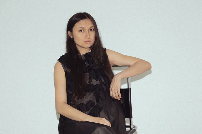 A portrait of fashion designer Meruert Tolegen wearing a black dress