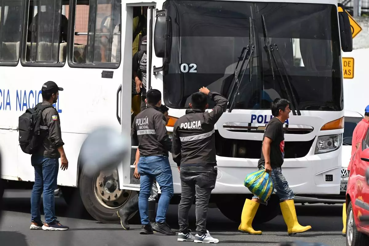 Crew members from the boat Maria Candelaria arrive at a police facility in Manta, Ecuador, Monday, Sept. 7, 2026, after being returned to the country following the interception of the vessel by U.S. authorities on suspicion of alleged drug trafficking. (AP Photo/Ariel Ochoa)