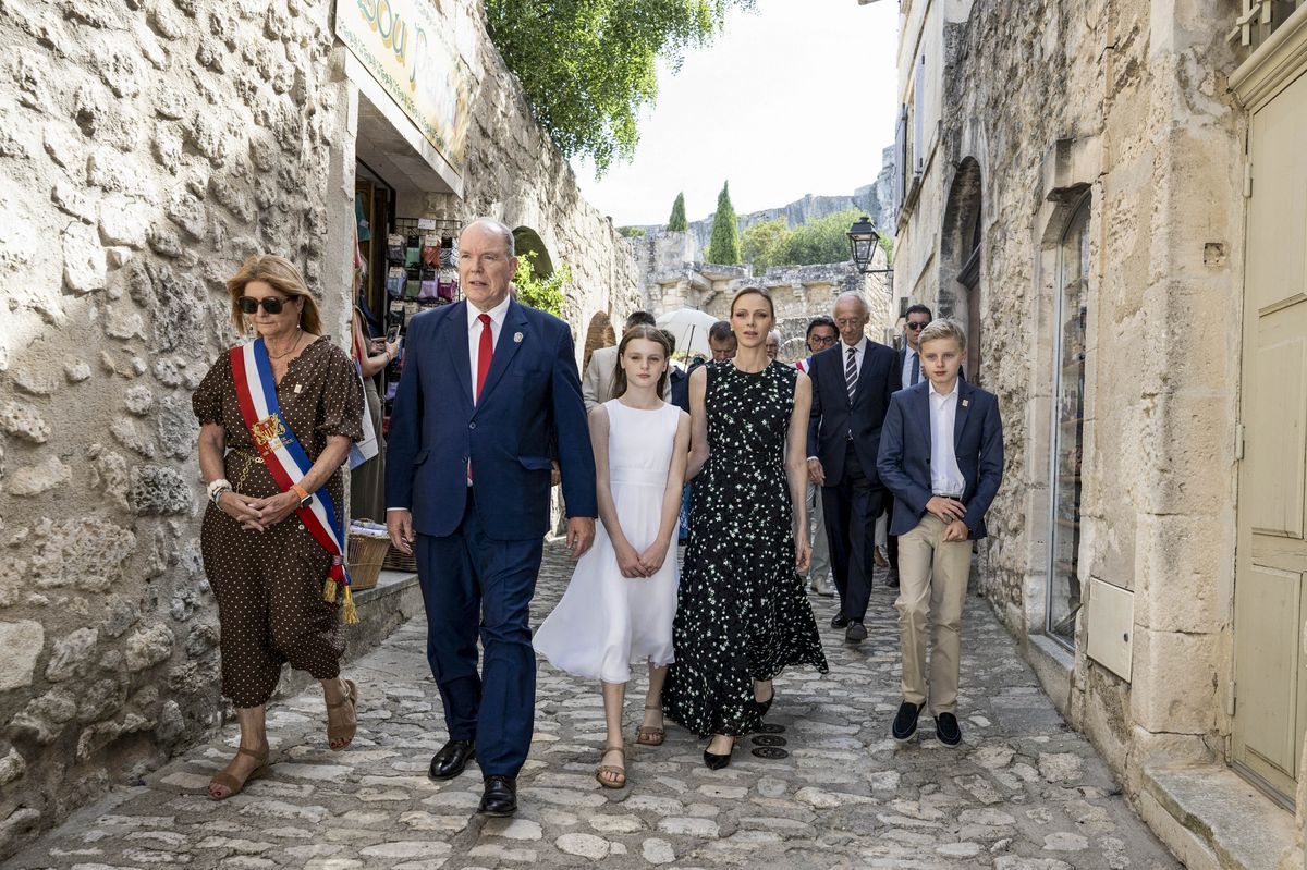 Princess Charlene steps out with her family in a black dress reminiscent of one Queen Letizia wore a decade ago