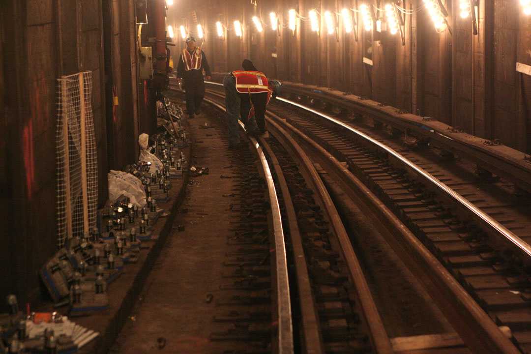 MTA track workers walking on rails