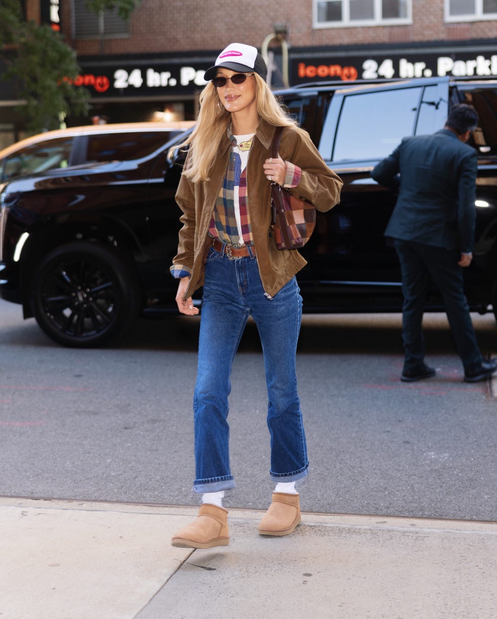new york city, ny supermodel bella hadid was spotted arriving in new york city during new york fashion week in a layered fall inspired look she wore a white tshirt, flannel shirt and brown suede jacket with cuffed dark denim, a trucker hat, white socks and ugg classic ultra mini boots, finishing the look with a coach coachtopia alterego slouchy shoulder bag pictured bella hadid backgrid usa 14 september 2026 usa 1 310 798 9111 usasalesbackgridcom uk 44 208 344 2007 uksalesbackgridcom uk clients pictures containing children please pixelate face prior to publication new york city, ny supermodel bella hadid was spotted arriving in new york city during new york fashion week in a layered fall inspired look she wore a white tshirt, flannel shirt and brown suede jacket with cuffed dark denim, a trucker hat, white socks and ugg classic ultra mini boots, finishing the look with a coach coachtopia alterego slouchy shoulder bag pictured bella hadid backgrid usa 14 september 2026 usa 1 310 798 9111 usasalesbackgridcom uk 44 208 344 2007 uksalesbackgridcom uk clients pictures containing children please pixelate face prior to publication