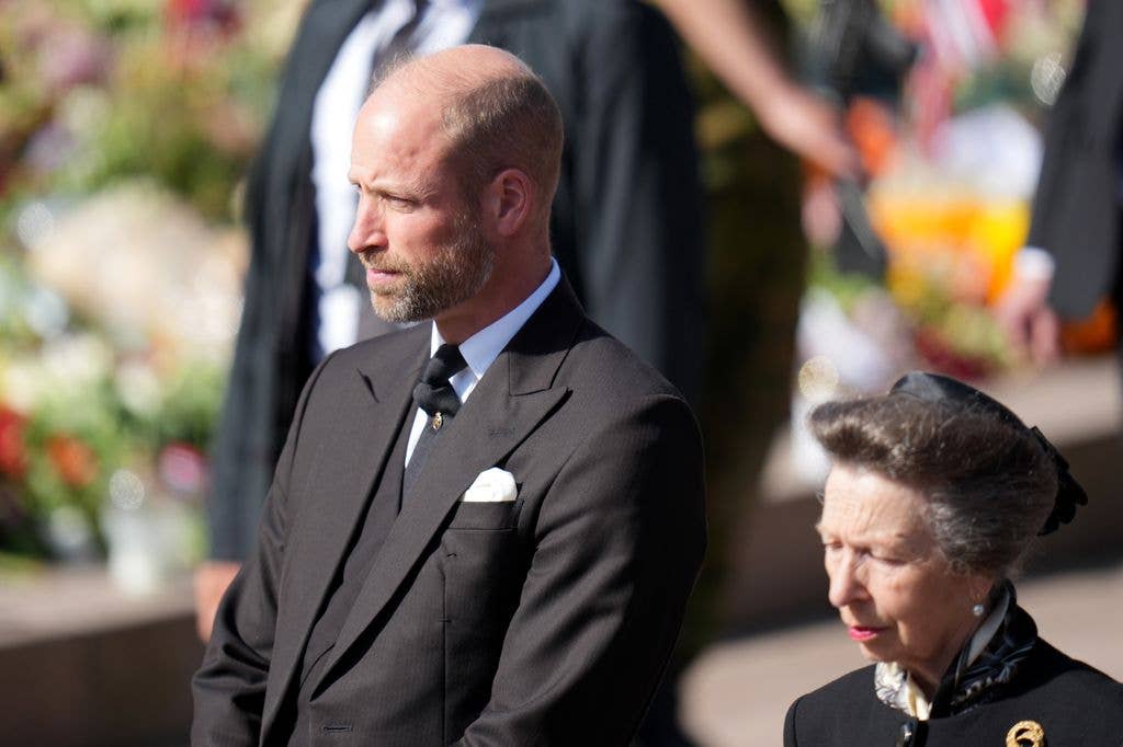 Prince William and Princess Anne walk behind the coffin