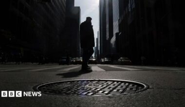 A photo of a manhole in New York City is shown